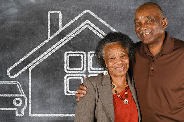 Couple in front of house